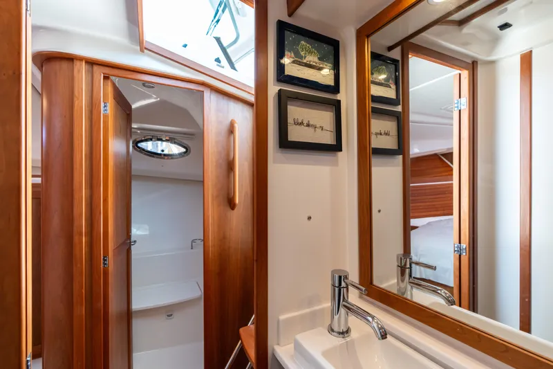 Slide: The Image of Luxurious bathroom interior of 2023 Back Cove 340 yacht with wood accents and modern fixtures. - 65
