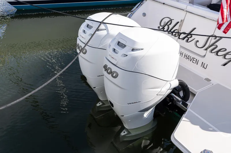 Slide: The Image of 2023 Back Cove 340 boat with twin 400 Verado outboard engines docked. - 69