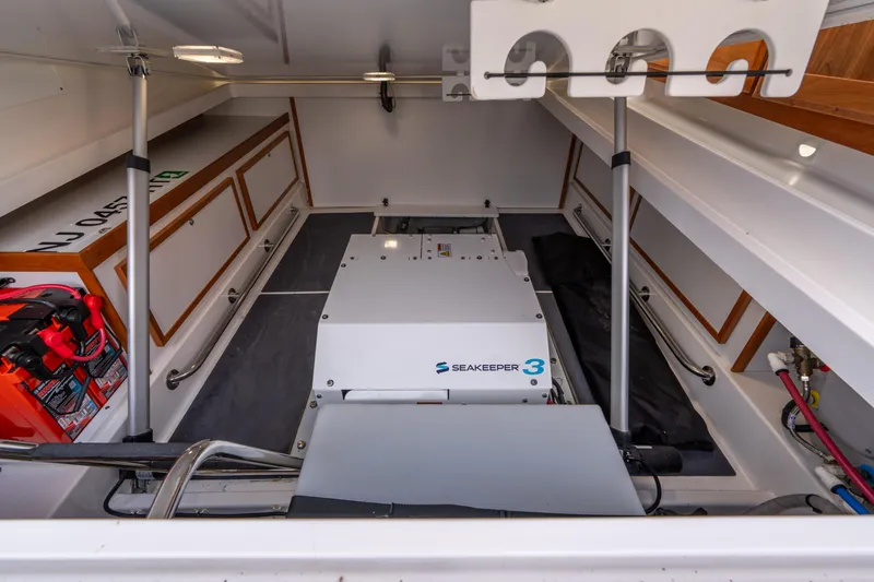 Slide: The Image of 2023 Back Cove 340 engine compartment with Seakeeper 3 stabilizer system. - 70