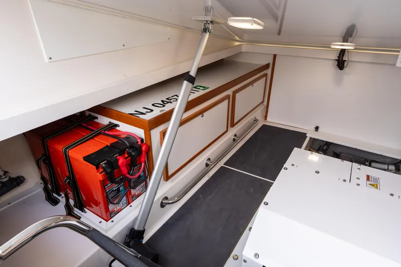 Slide: The Image of 2023 Back Cove 340 boat interior with storage and battery compartment. - 71