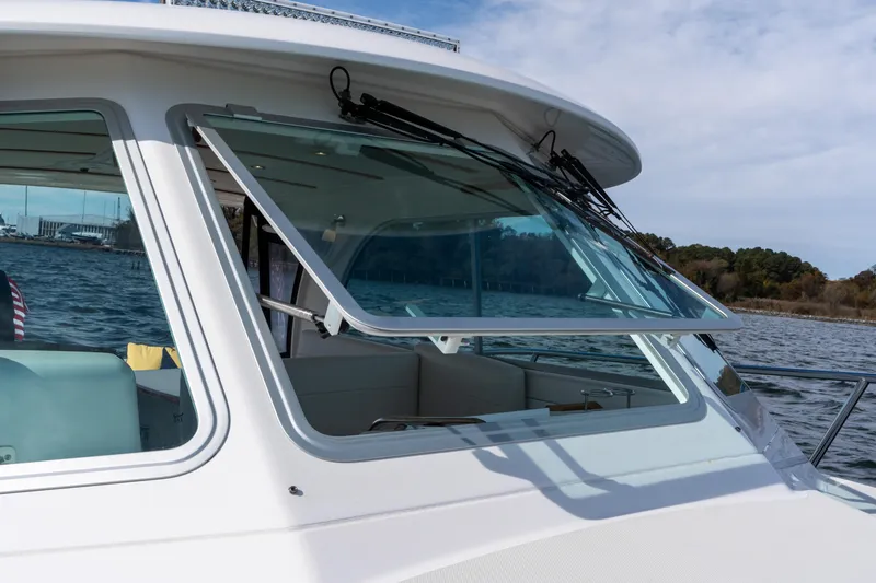 Slide: The Image of 2023 Back Cove 340 boat with open windshield on a sunny day. - 79