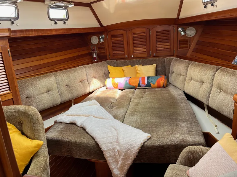 Slide: The Image of Cozy interior of 1996 Gozzard 44 AC sailboat with plush seating and colorful pillows. - 14