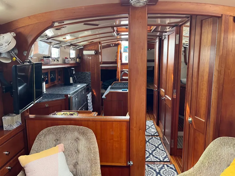 Slide: The Image of Interior of 1996 Gozzard 44 AC yacht with wooden cabinetry and modern amenities. - 16