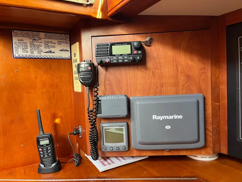 Slide: The Image of Navigation equipment on a 1996 Gozzard 44 AC sailboat, featuring Raymarine and communication devices. - 17