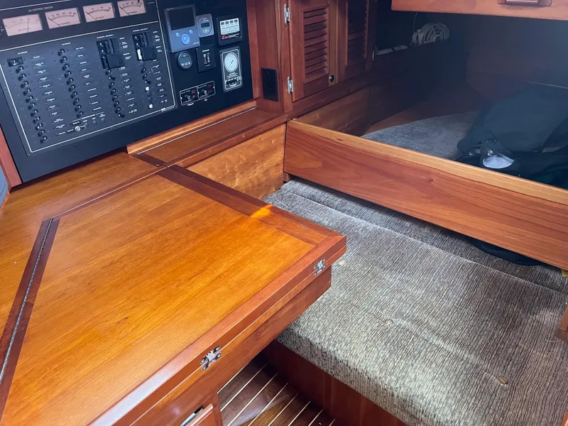Slide: The Image of Interior of 1996 Gozzard 44 AC yacht with wooden cabinetry and control panel. - 19