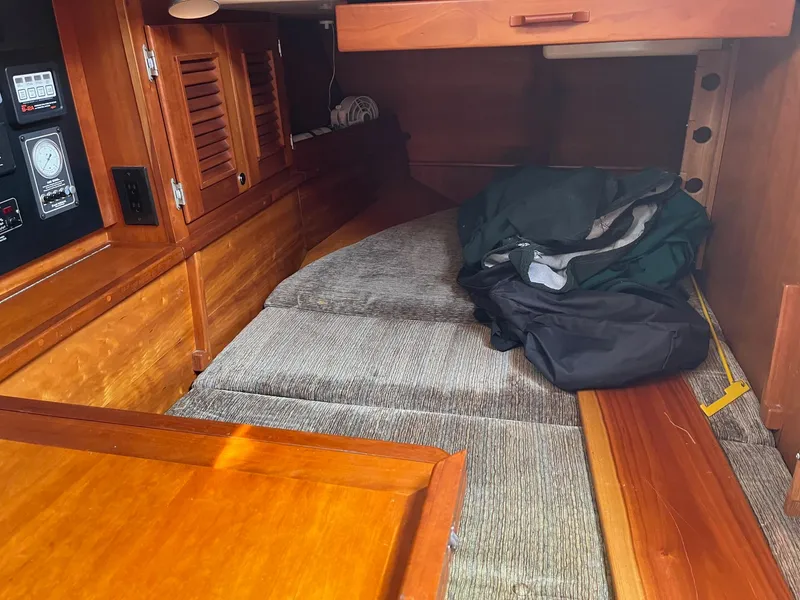 Slide: The Image of Interior cabin of 1996 Gozzard 44 AC sailboat with wooden finish and cushions. - 20