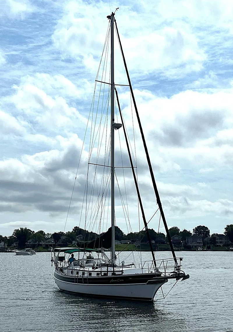 Slide: The Image of Sailing yacht Gozzard 44 AC, 1996 model, on calm waters under a cloudy sky. - 4