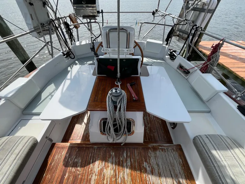 Slide: The Image of Cockpit of 1996 Gozzard 44 AC sailboat with wooden flooring and seating. - 8