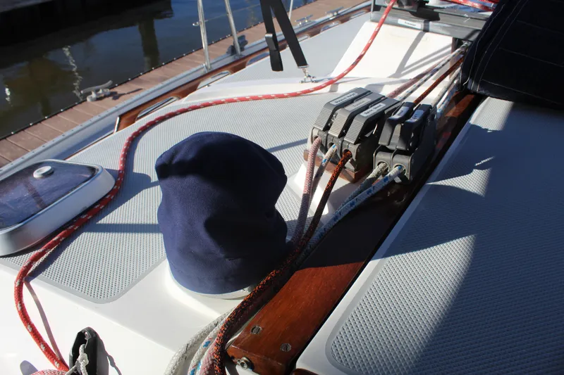 Slide: The Image of Deck of 1990 Catalina 42 sailboat with ropes and cleats in sunlight. - 8
