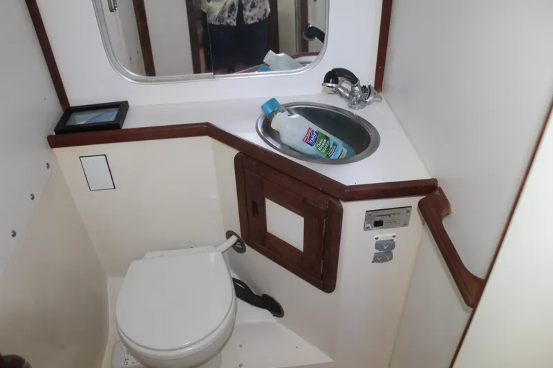 Slide: The Image of Bathroom interior of a 1990 Catalina 42 yacht with sink and toilet. - 26