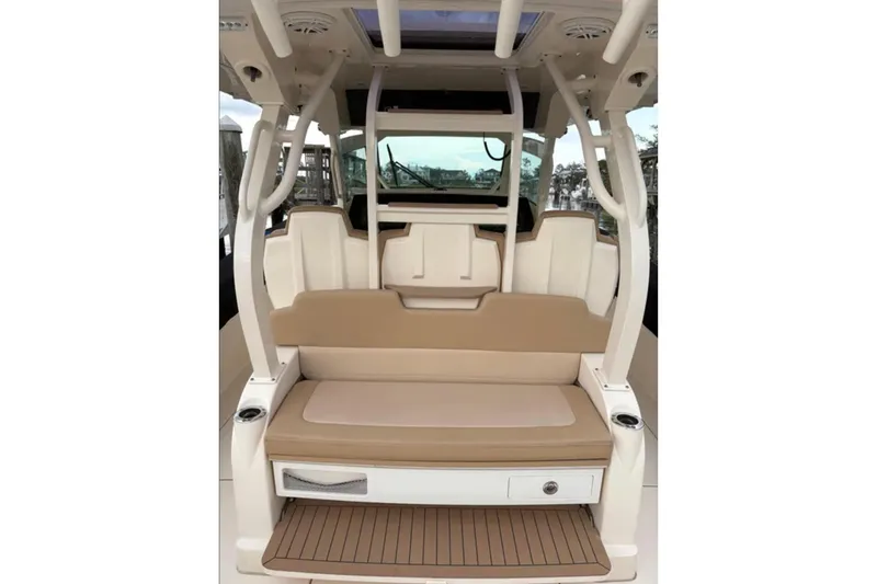 Slide: The Image of 2019 Scout 380 LXF boat interior with tan seating and modern design. - 18