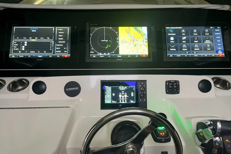 Slide: The Image of 2019 Scout 380 LXF dashboard with advanced Garmin navigation displays and controls. - 22
