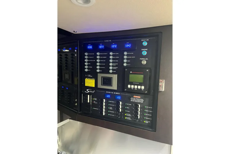 Slide: The Image of Control panel of a 2019 Scout 380 LXF boat with digital displays and switches. - 26