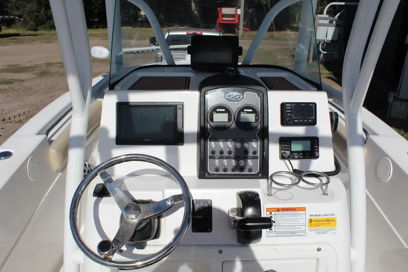 Slide: The Image of 2018 Sea Fox 226 Commander boat dashboard with steering wheel and navigation controls. - 15