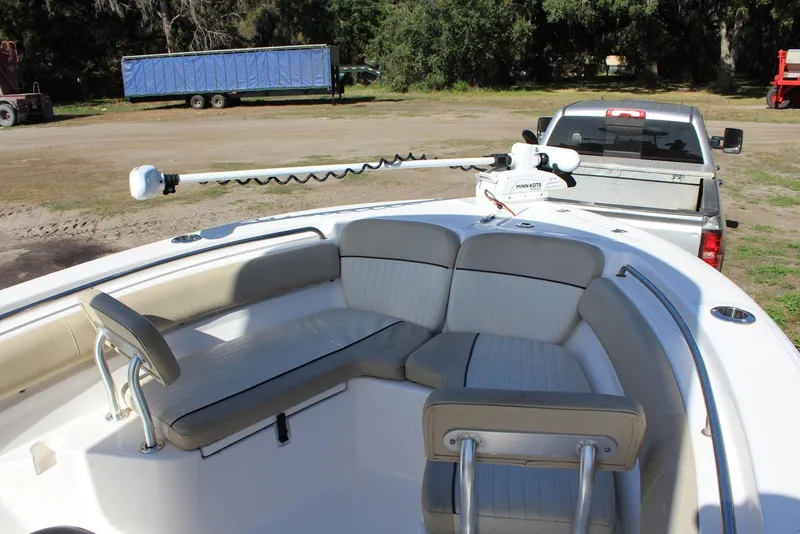 Slide: The Image of 2018 Sea Fox 226 Commander boat interior with seating, parked on a trailer. - 18