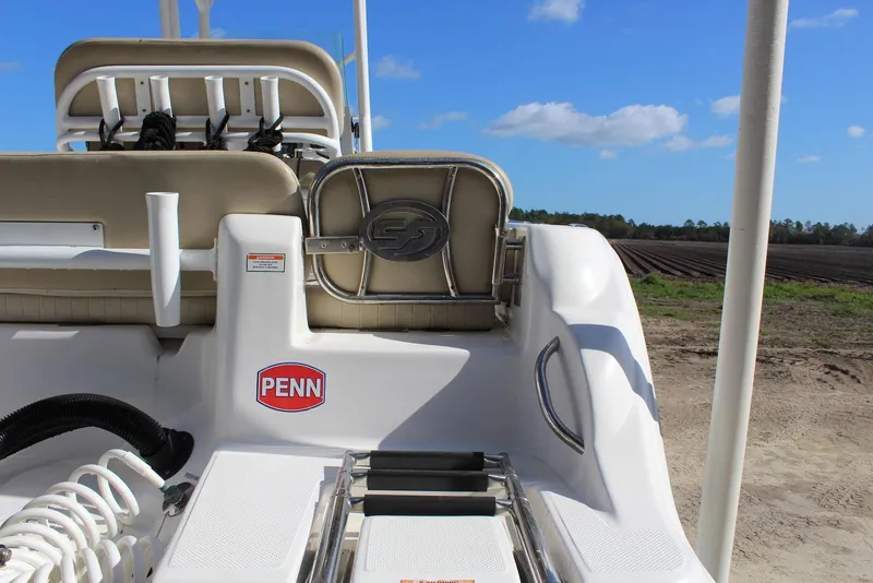 Slide: The Image of 2018 Sea Fox 226 Commander boat interior with Penn logo, against a rural landscape. - 23