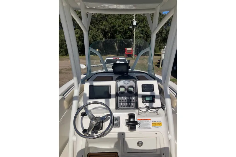 Slide: The Image of 2018 Sea Fox 226 Commander boat dashboard with steering wheel and navigation controls. - 28