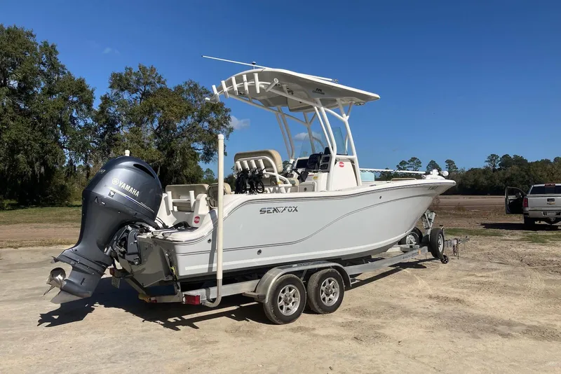 Slide: The Image of 2018 Sea Fox 226 Commander boat on trailer with Yamaha outboard motor, parked outdoors. - 9
