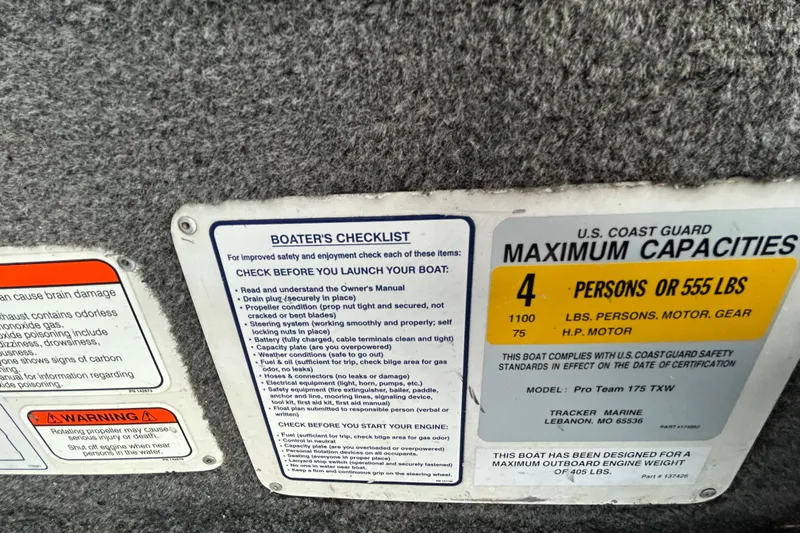 Slide: The Image of 2014 Bass Tracker PRO TEAM 175 TXW boat on trailer by a lake at sunset. - 14