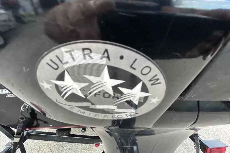 Slide: The Image of 2014 Bass Tracker PRO TEAM 175 TXW boat at sunset by a lake. - 17