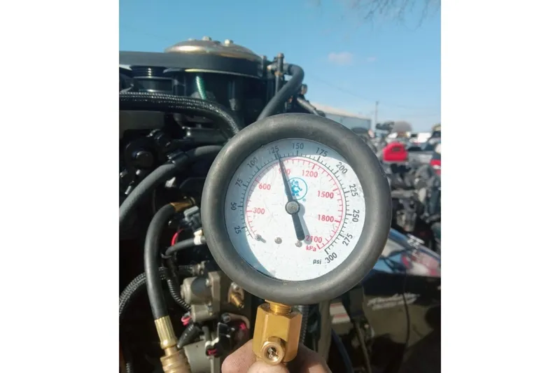 Slide: The Image of 2014 Bass Tracker PRO TEAM 175 TXW boat on trailer at sunset by a lake. - 18