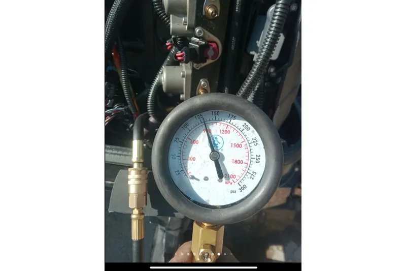 Slide: The Image of 2014 Bass Tracker PRO TEAM 175 TXW boat at a lakeside dock during sunset. - 20