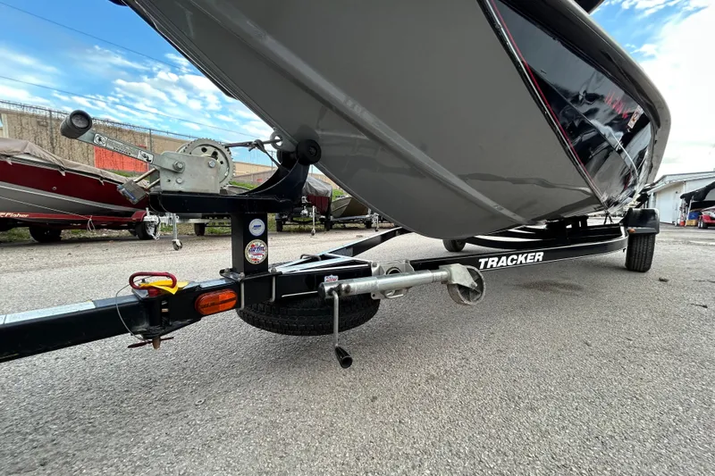 Slide: The Image of 2014 Bass Tracker PRO TEAM 175 TXW boat on trailer by a lakeside. - 3