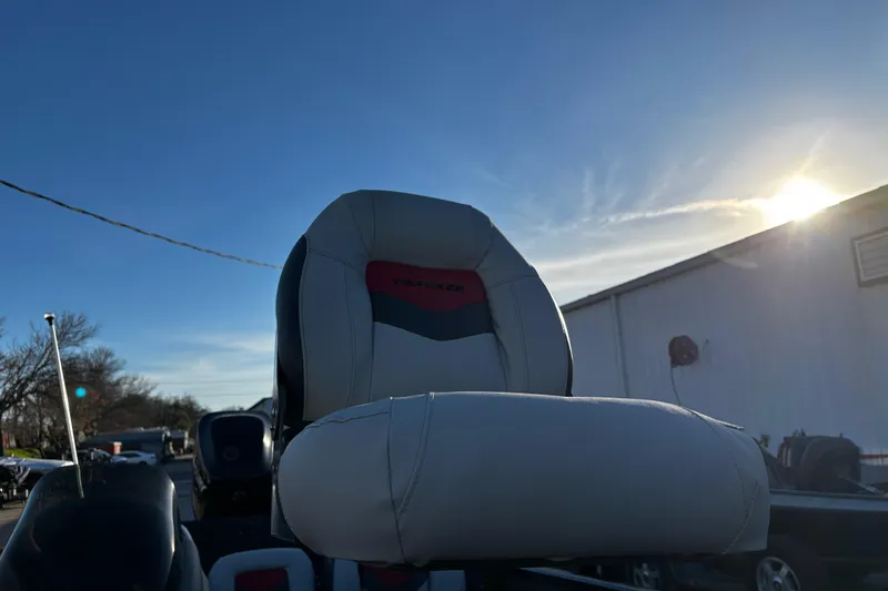 Slide: The Image of 2014 Bass Tracker PRO TEAM 175 TXW boat interior with three seats by the water. - 32