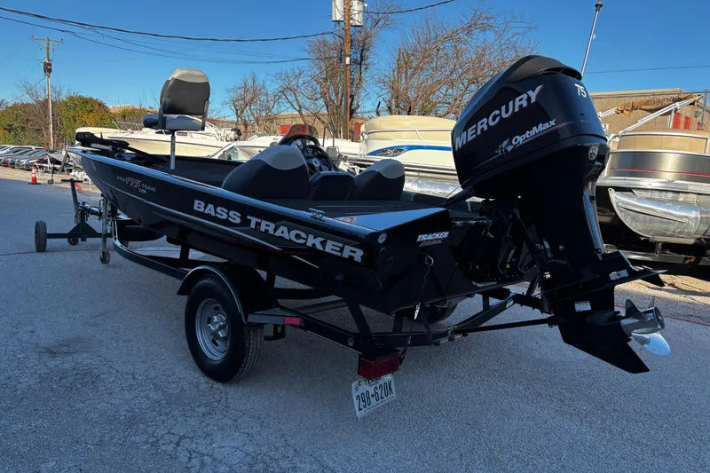 Slide: The Image of 2014 Bass Tracker PRO TEAM 175 TXW interior with seat and storage compartment. - 38