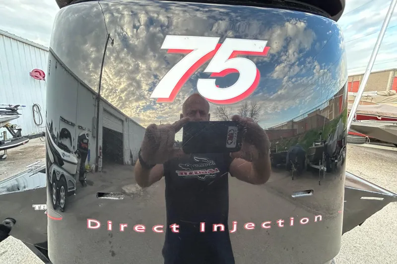 Slide: The Image of 2014 Bass Tracker PRO TEAM 175 TXW boat on trailer by a lakeside. - 4