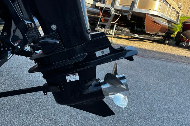 Slide: The Image of 2014 Bass Tracker PRO TEAM 175 TXW boat battery compartment with wiring and components. - 40