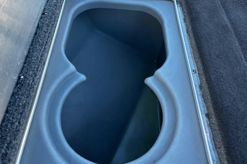 Slide: The Image of Control panel of a 2014 Bass Tracker PRO TEAM 175 TXW boat with toggle switches. - 48