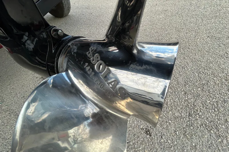 Slide: The Image of 2014 Bass Tracker PRO TEAM 175 TXW boat with Mercury engine in parking lot. - 6