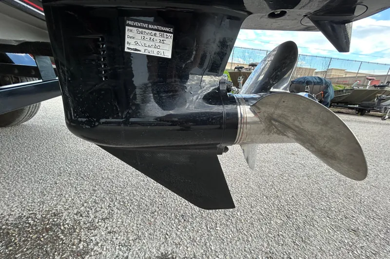 Slide: The Image of 2014 Bass Tracker PRO TEAM 175 TXW boat with outboard motor in parking lot. - 7