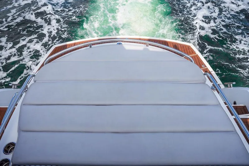 Slide: The Image of 2013 Sunseeker Portafino yacht with wooden deck, on calm water. - 12