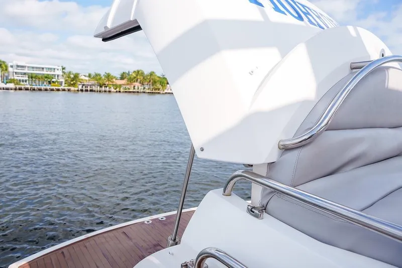 Slide: The Image of 2013 Sunseeker Portafino yacht interior with waterfront view and nearby boats. - 14