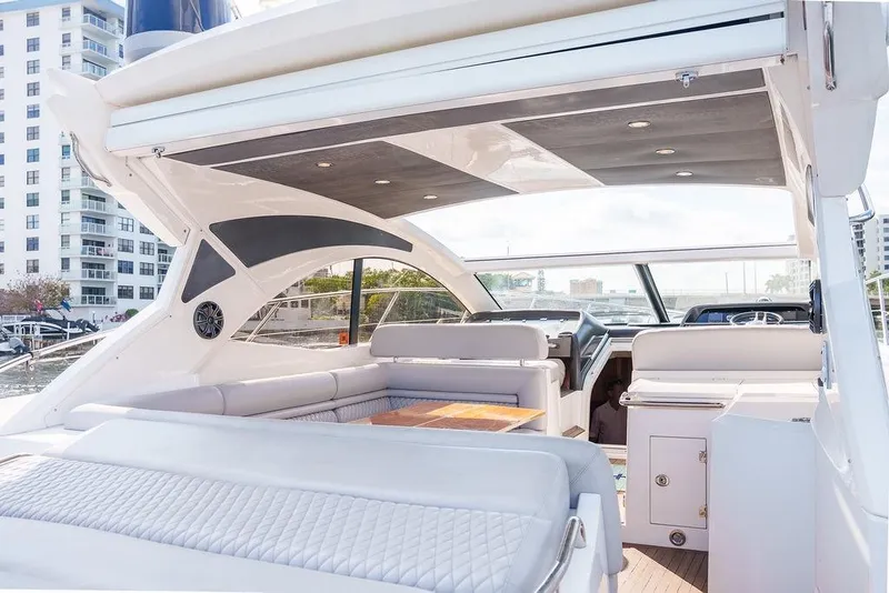 Slide: The Image of Luxurious interior of 2013 Sunseeker Portafino yacht with elegant seating and wooden table. - 16