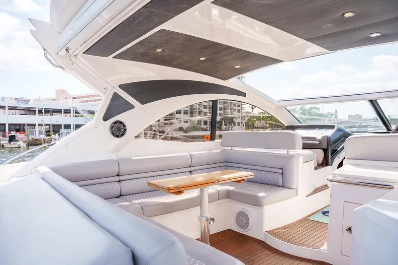 Slide: The Image of Luxurious interior of 2013 Sunseeker Portafino yacht with elegant seating and wooden table. - 18