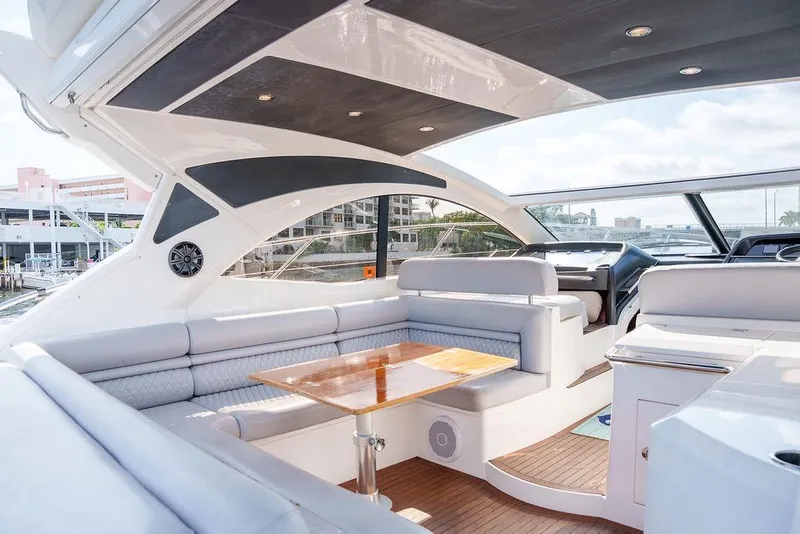 Slide: The Image of Luxurious 2013 Sunseeker Portafino yacht interior with modern seating and sleek design. - 19