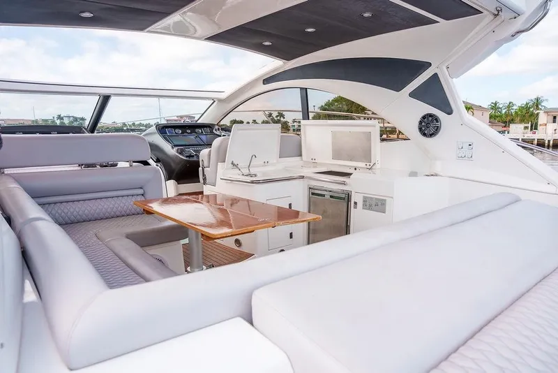 Slide: The Image of 2013 Sunseeker Portafino yacht interior with lighthouse view, featuring modern navigation controls. - 20