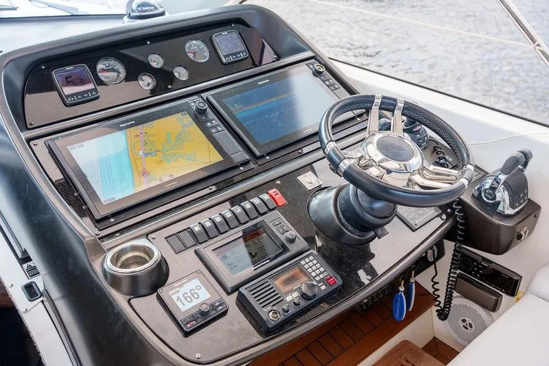 Slide: The Image of Control panel of a 2013 Sunseeker Portafino yacht with yacht controller. - 39