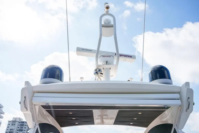 Slide: The Image of Radar equipment on a 2013 Sunseeker Portafino yacht against a cloudy sky. - 42
