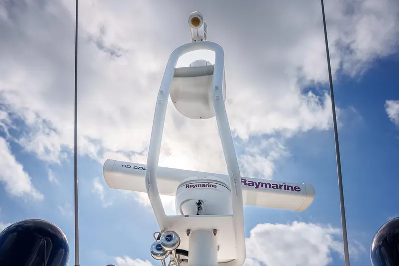 Slide: The Image of Cockpit of 2013 Sunseeker Portafino yacht with navigation controls and steering wheel. - 43