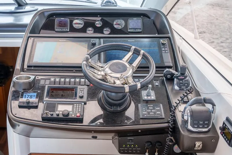 Slide: The Image of Luxurious interior of 2013 Sunseeker Portafino yacht with cream leather seating and wooden accents. - 44