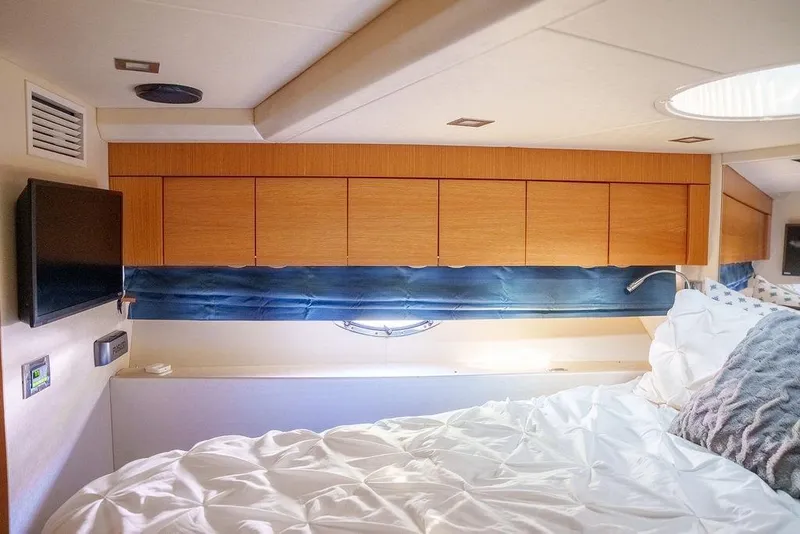 Slide: The Image of Luxurious bedroom interior of 2013 Sunseeker Portafino yacht with plush bedding. - 51