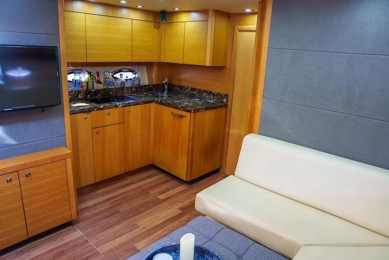 Slide: The Image of Luxurious interior of 2013 Sunseeker Portafino yacht with modern seating and wooden accents. - 54