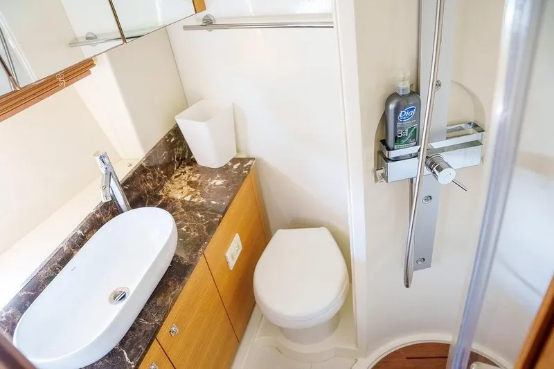 Slide: The Image of Luxurious 2013 Sunseeker Portafino yacht interior with cozy bedroom and modern bathroom. - 57