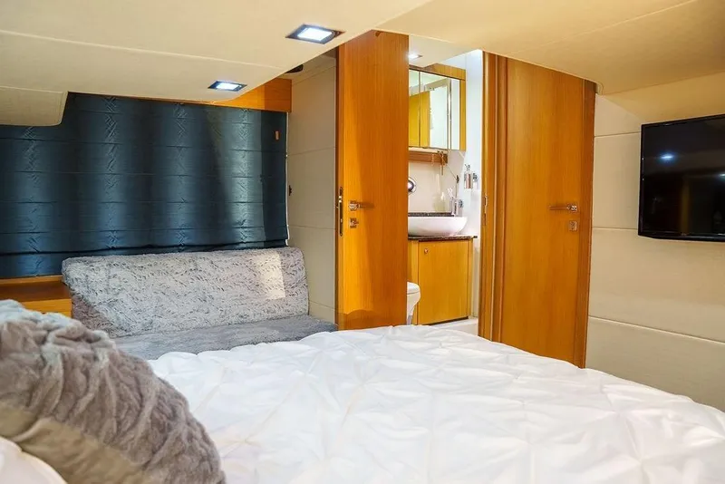 Slide: The Image of Luxurious Sunseeker Portafino 2013 yacht bedroom with cozy bedding and modern decor. - 59