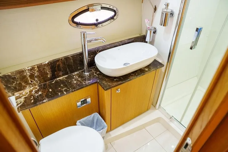 Slide: The Image of Luxurious bathroom in 2013 Sunseeker Portafino yacht with shower and mirror. - 64