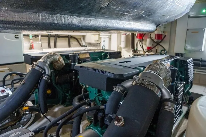 Slide: The Image of Engine room of a 2013 Sunseeker Portafino yacht, featuring Cummins Onan generator. - 70